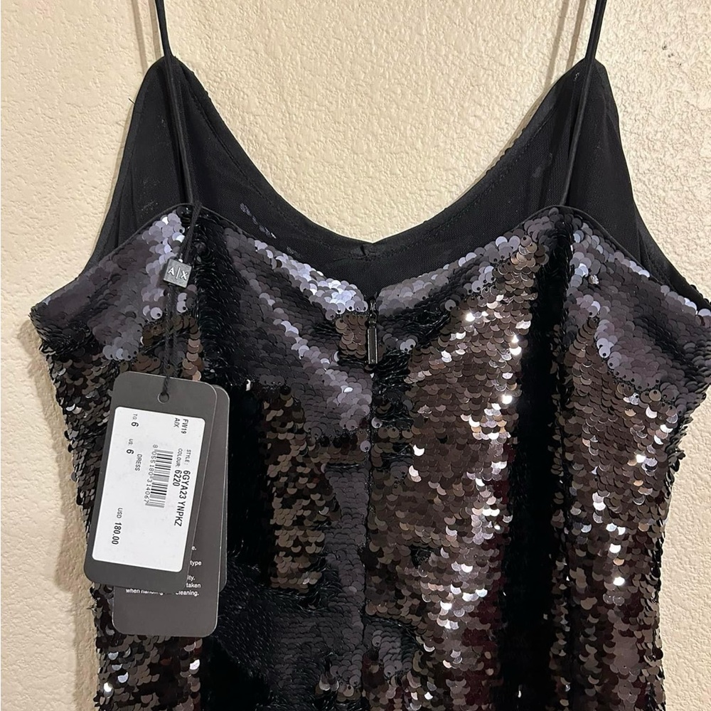 Beautiful Black Sequin Dresss. Never worn, price tag is still on.